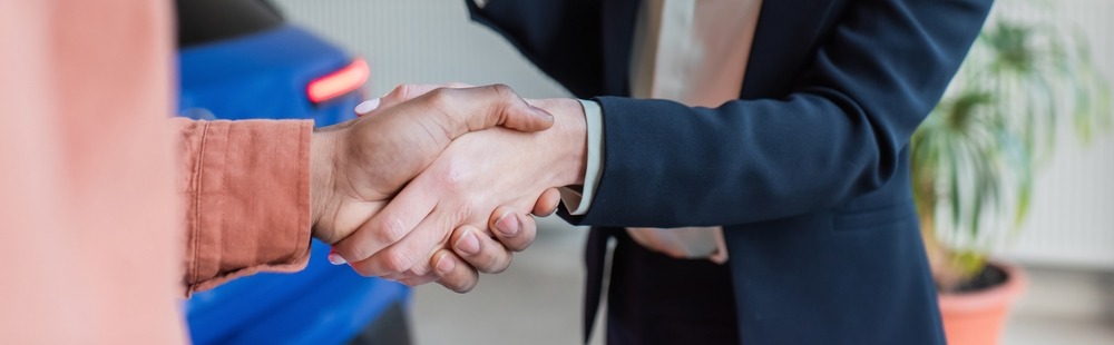 Close up of people shaking hands
